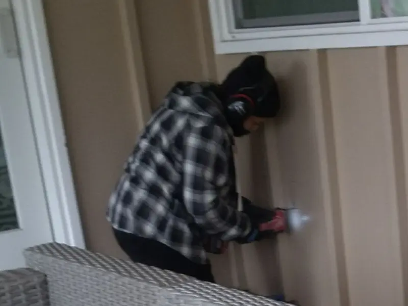 Professional electrician installing an exterior outlet in Kettering
