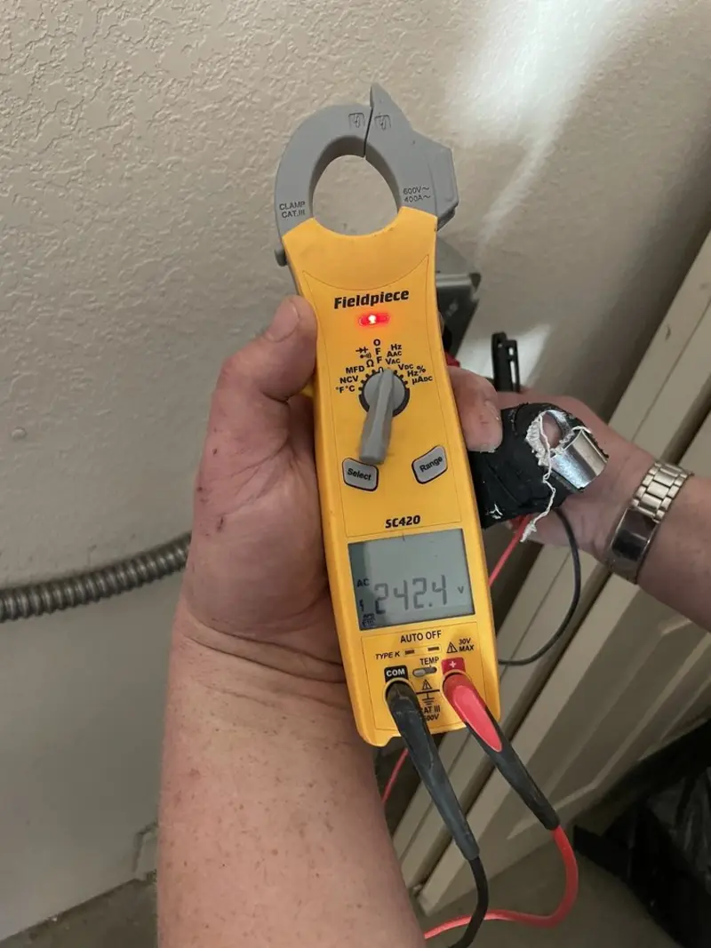 Voltage testing with clamp meter during Circuit Breaker Repair in Kettering